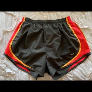 Grey and red Nike shorts, size M